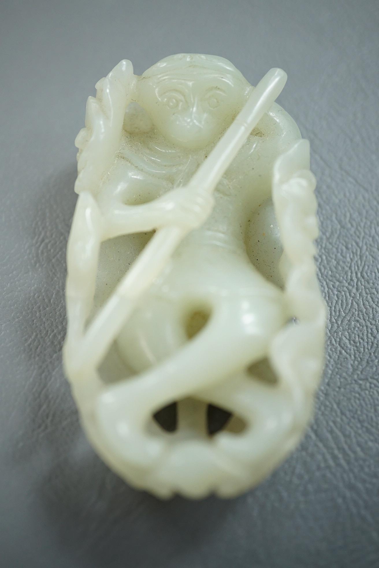 A Chinese pale celadon jade carving of Sun Wukong, the Monkey King, 18th/19th century